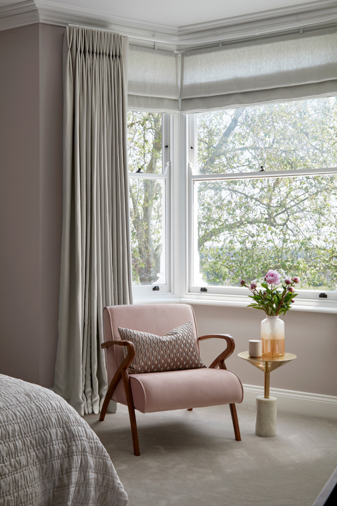 Design ideas for a large contemporary master bedroom in London with pink walls, carpet and pink floors.