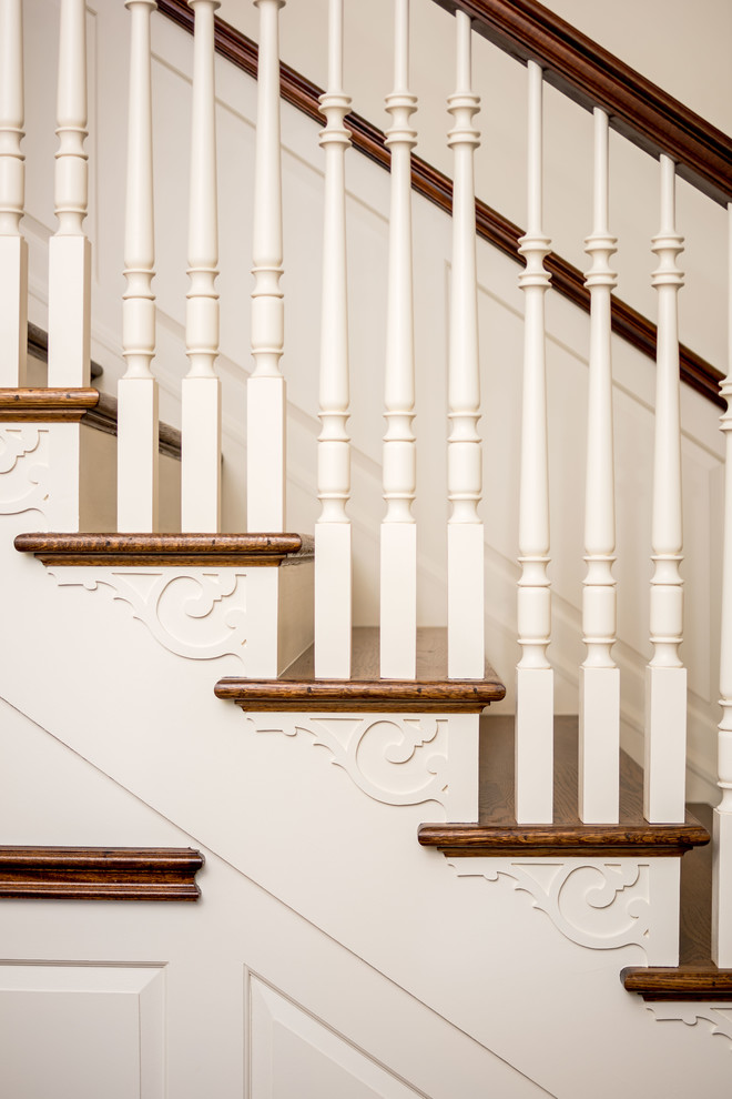 Inspiration for a traditional wood straight staircase in Philadelphia with painted wood risers.
