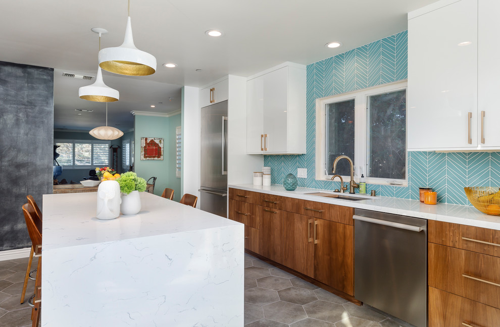Design ideas for a large midcentury u-shaped separate kitchen in Los Angeles with an undermount sink, flat-panel cabinets, medium wood cabinets, quartzite benchtops, blue splashback, glass tile splashback, stainless steel appliances, cement tiles, with island and grey floor.