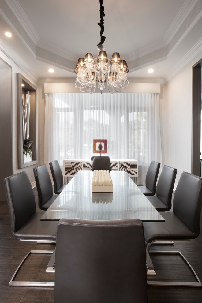 Inspiration for a large transitional dining room in Miami with white walls, dark hardwood floors and no fireplace.