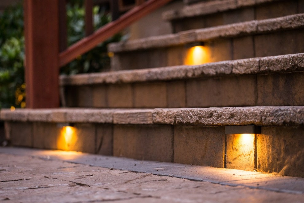 Example of a large mountain style front door design in Portland with a light wood front door