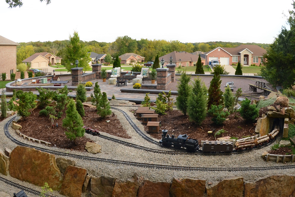 Mountain style backyard brick patio photo