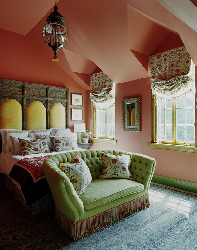 Inspiration for a mid-sized eclectic guest bedroom in New York with pink walls, carpet and blue floor.