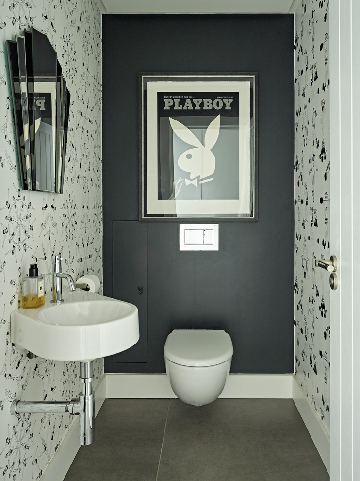 Inspiration for a large contemporary powder room in Hertfordshire with white floor.