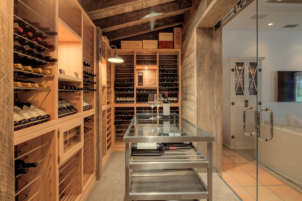 Design ideas for a mid-sized transitional wine cellar in Miami with display racks.