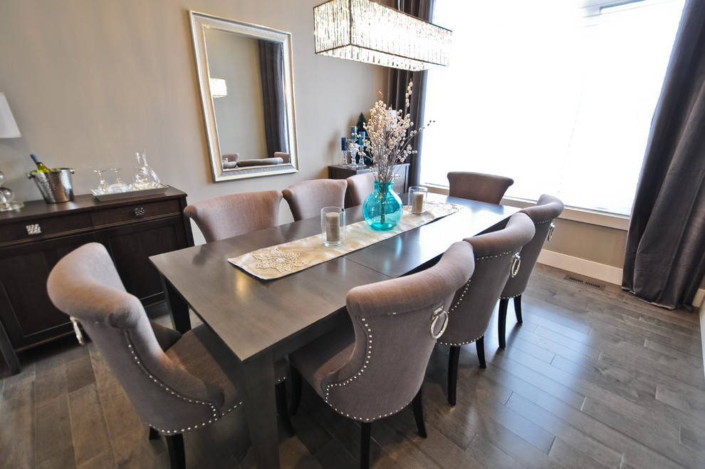 Example of a transitional light wood floor and gray floor enclosed dining room design in Edmonton with gray walls and no fireplace