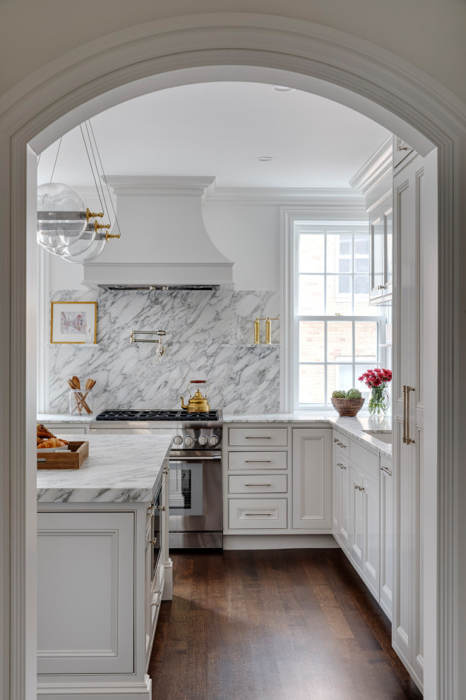 Enclosed kitchen - small transitional l-shaped dark wood floor and brown floor enclosed kitchen idea in Boston with an undermount sink, shaker cabinets, white cabinets, marble countertops, white backsplash, marble backsplash, paneled appliances, an island and white countertops