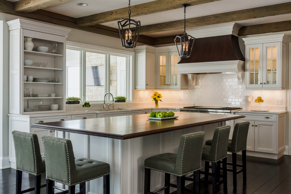 Eat-in kitchen - large transitional l-shaped dark wood floor eat-in kitchen idea in Chicago with an undermount sink, recessed-panel cabinets, quartz countertops, ceramic backsplash, stainless steel appliances, an island, white cabinets and white backsplash
