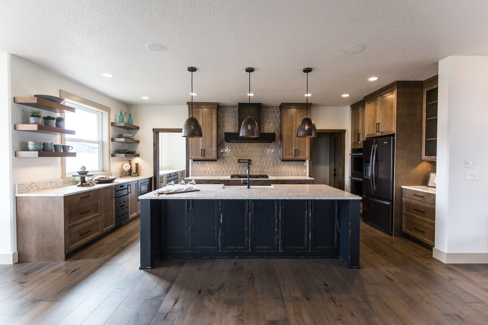 This is an example of a transitional u-shaped kitchen in Other with a farmhouse sink, recessed-panel cabinets, medium wood cabinets, beige splashback, black appliances, dark hardwood floors, with island, brown floor and beige benchtop.