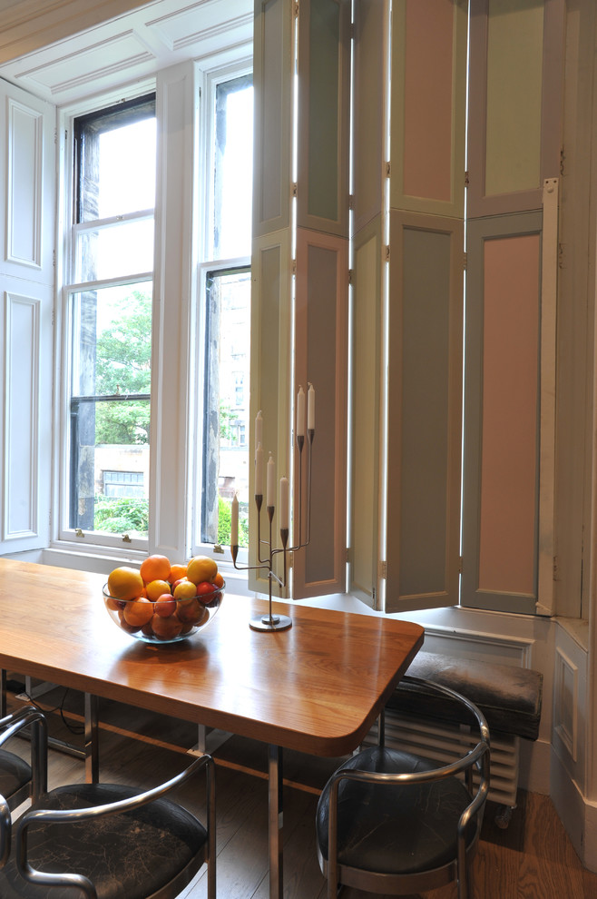 This is an example of a transitional dining room in Glasgow.