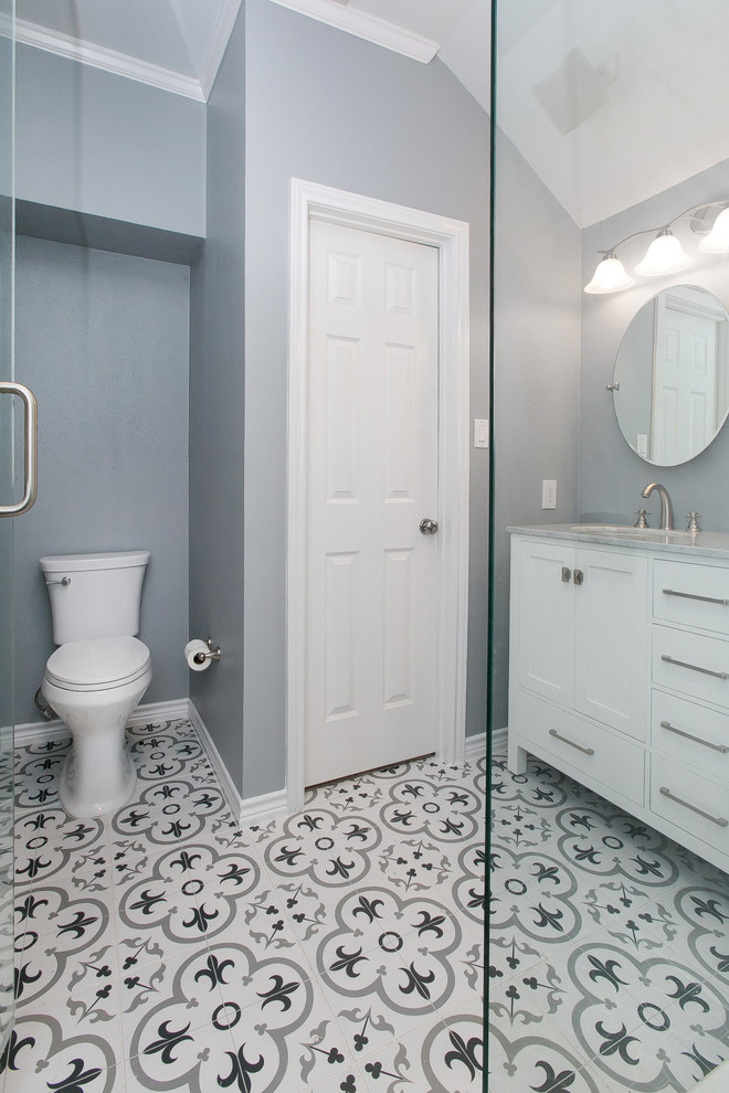 Design ideas for a small contemporary 3/4 bathroom in Dallas with shaker cabinets, white cabinets, a corner shower, gray tile, white tile, porcelain tile, grey walls, cement tiles, an undermount sink, marble benchtops, multi-coloured floor, a hinged shower door, grey benchtops and a one-piece toilet.