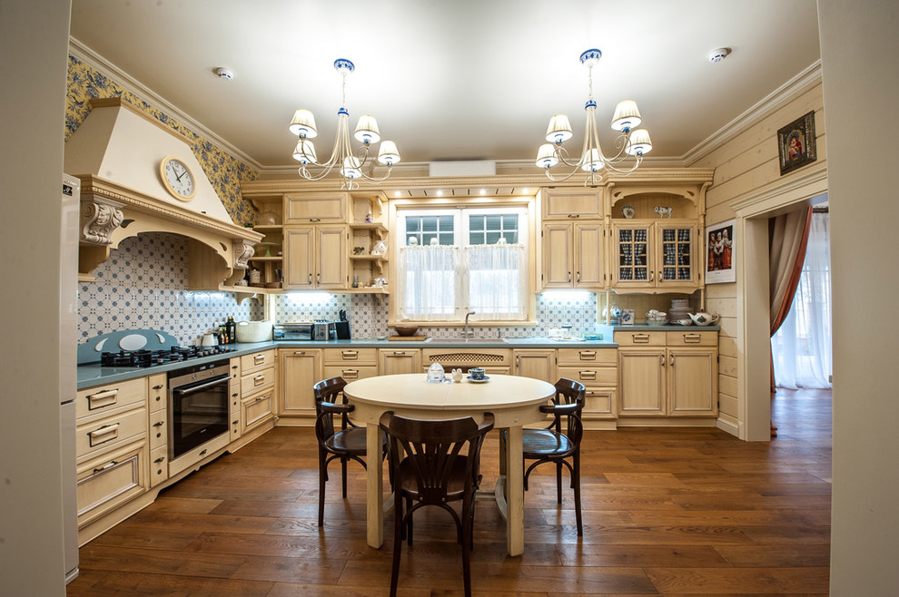 Design ideas for a country l-shaped separate kitchen in Other with recessed-panel cabinets, beige cabinets, multi-coloured splashback, dark hardwood floors and brown floor.