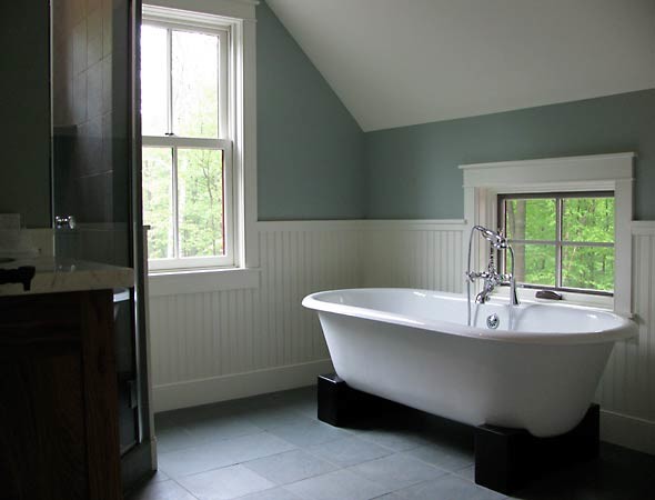 Photo of a mid-sized traditional bathroom in Burlington with a freestanding tub, gray tile, ceramic tile, blue walls and ceramic floors.