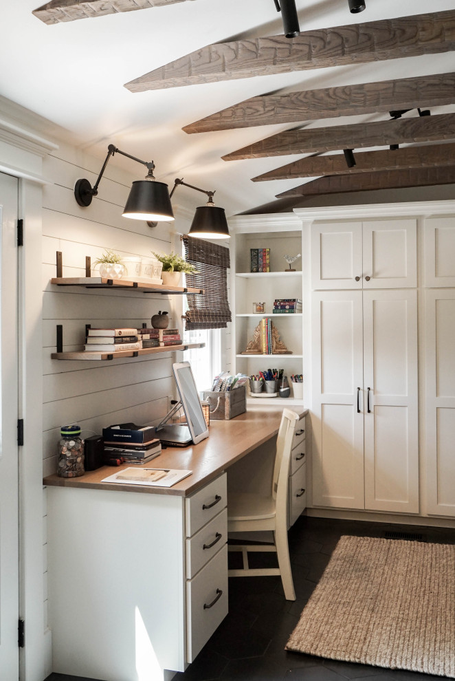 This is an example of a small country mudroom in Other with white walls, ceramic floors, a single front door, a medium wood front door, grey floor, exposed beam and planked wall panelling.