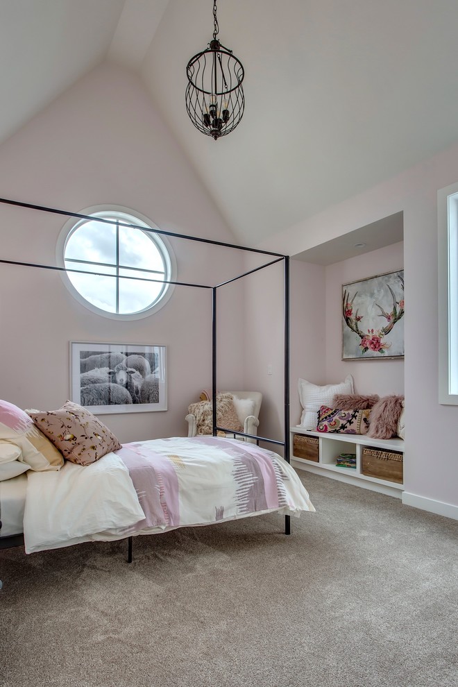 This is an example of a mid-sized country bedroom in Calgary with pink walls, carpet and beige floor.