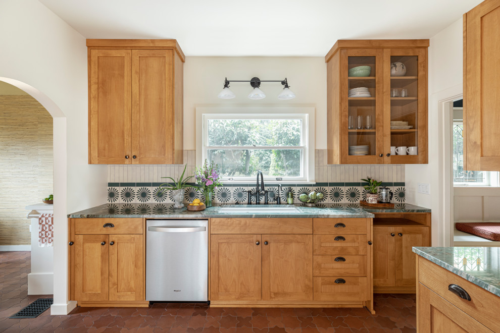 Inspiration for a mid-sized eclectic l-shaped separate kitchen in Portland with an undermount sink, shaker cabinets, medium wood cabinets, quartzite benchtops, green splashback, terra-cotta splashback, stainless steel appliances, porcelain floors, no island, orange floor and green benchtop.
