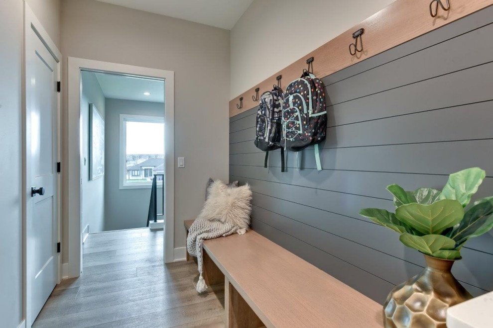 Inspiration for a transitional mudroom remodel with gray walls