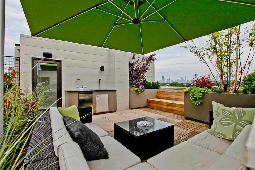 Contemporary rooftop and rooftop deck in Chicago with a fire feature.