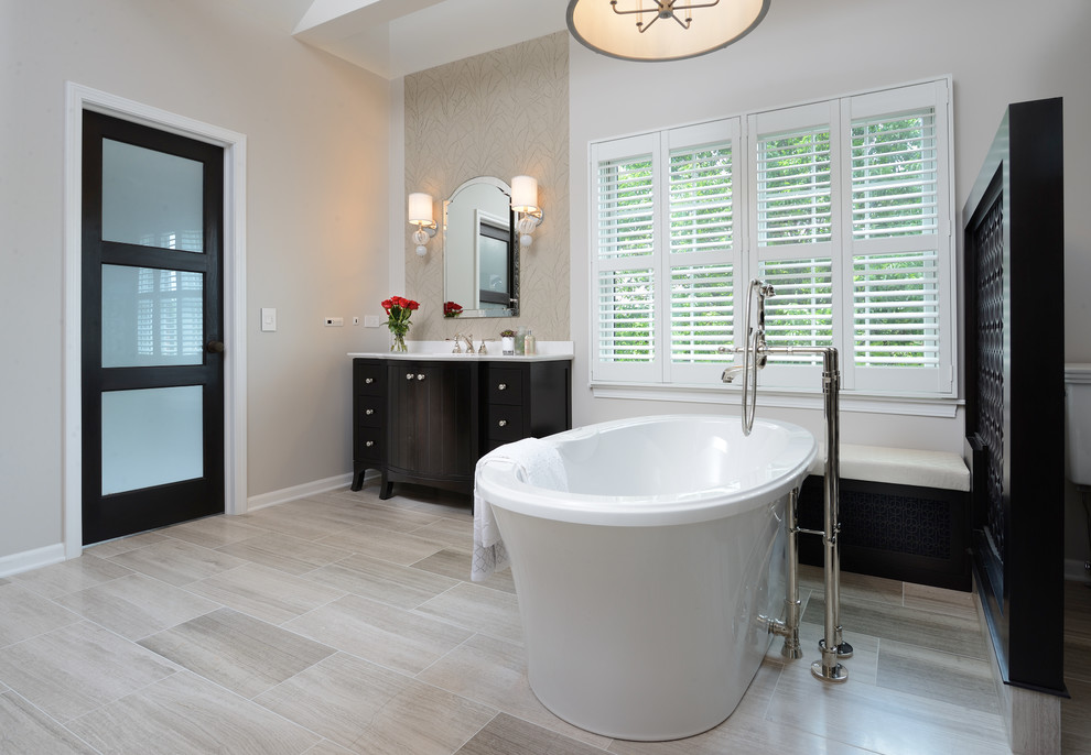 Inspiration for a large transitional master brown tile and marble tile marble floor and gray floor bathroom remodel in Other with brown cabinets, quartz countertops and a hinged shower door