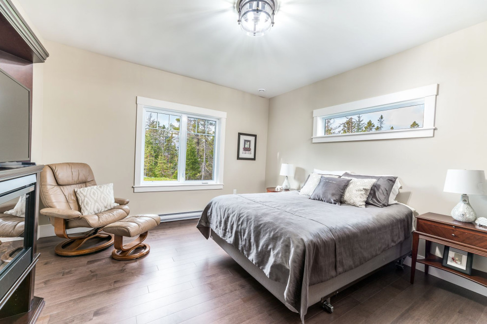 Bedroom - mid-sized transitional medium tone wood floor and brown floor bedroom idea with beige walls