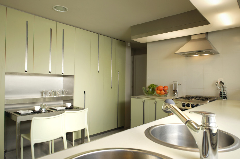 Modern kitchen in Other with stainless steel appliances.
