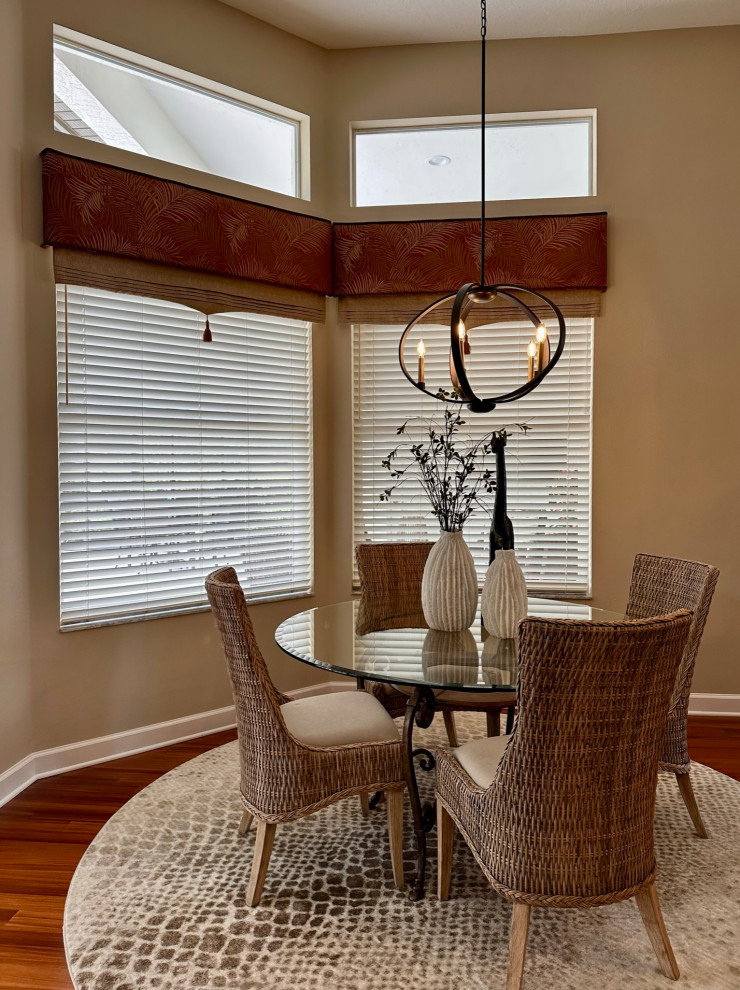Inspiration for a mid-sized transitional dining room in Orlando with beige walls and dark hardwood floors.
