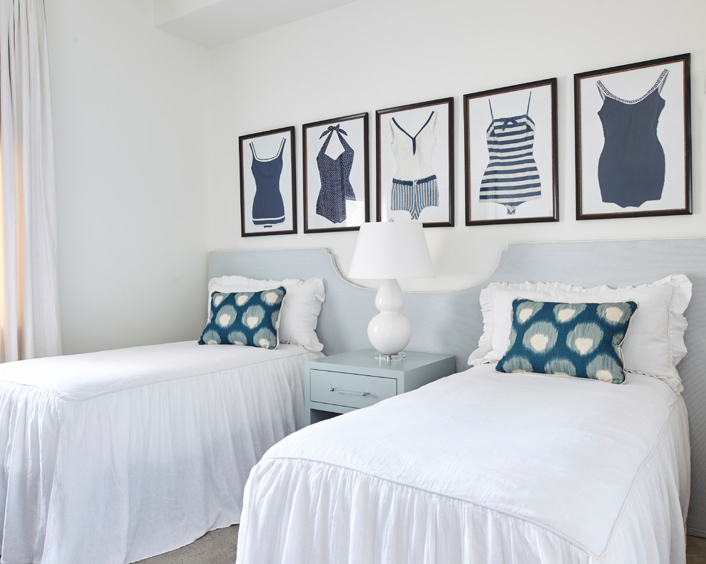 This is an example of a beach style guest bedroom in Other with white walls, carpet, no fireplace and grey floor.