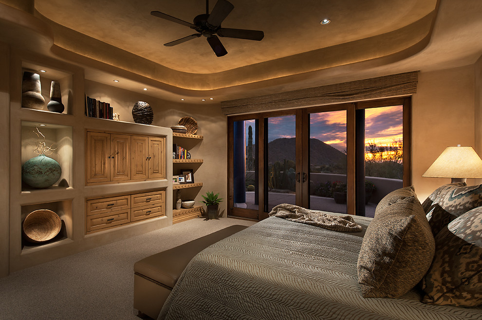Mid-sized master bedroom in Phoenix with beige walls, carpet and no fireplace.