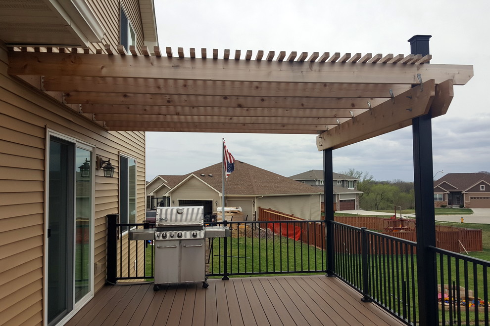 Inspiration for a large backyard deck remodel with a pergola