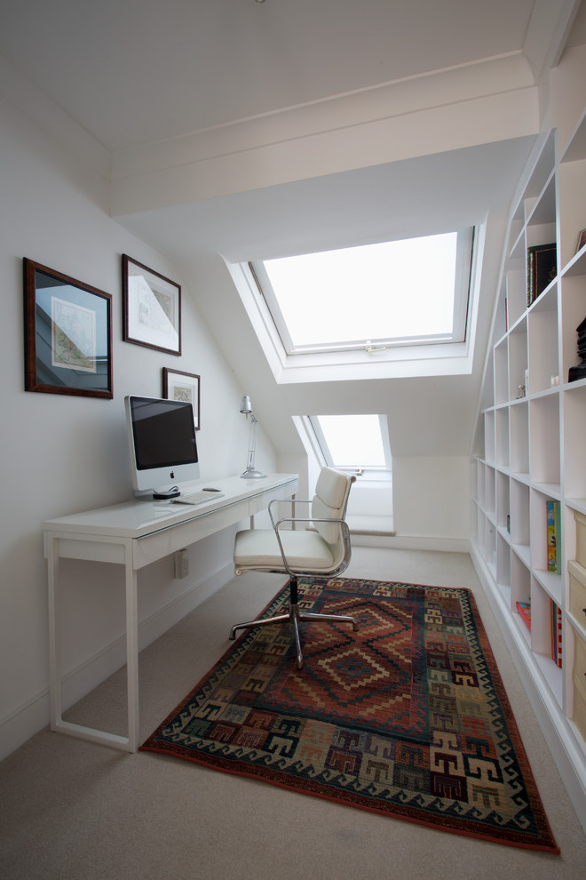 Small contemporary study room in London with white walls, carpet, no fireplace and a freestanding desk.