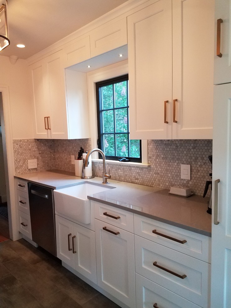 Example of a mid-sized transitional galley porcelain tile and gray floor eat-in kitchen design in Seattle with a farmhouse sink, shaker cabinets, white cabinets, quartz countertops, multicolored backsplash, stone tile backsplash, stainless steel appliances and no island