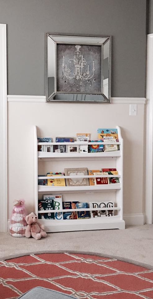 Photo of a small transitional nursery for girls in DC Metro with grey walls and carpet.