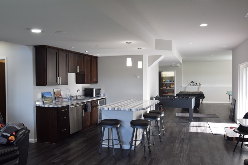 This is an example of a large transitional single-wall open plan kitchen in Other with vinyl floors, an undermount sink, shaker cabinets, dark wood cabinets, quartzite benchtops and with island.