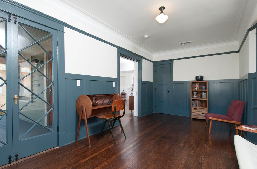 Inspiration for a mid-sized arts and crafts study room in Los Angeles with blue walls and dark hardwood floors.