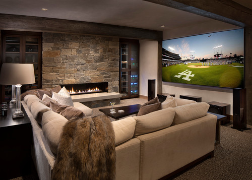 sectional sofa in a media room with a fireplace