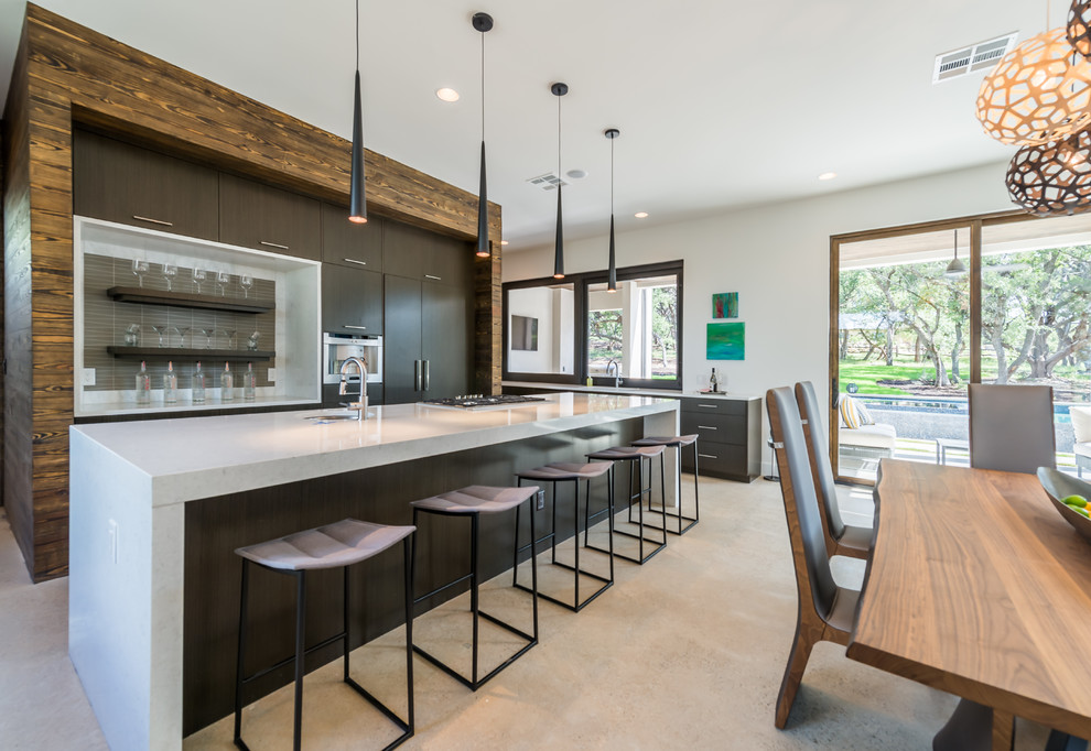 Inspiration for a contemporary galley eat-in kitchen in Austin with flat-panel cabinets and with island.