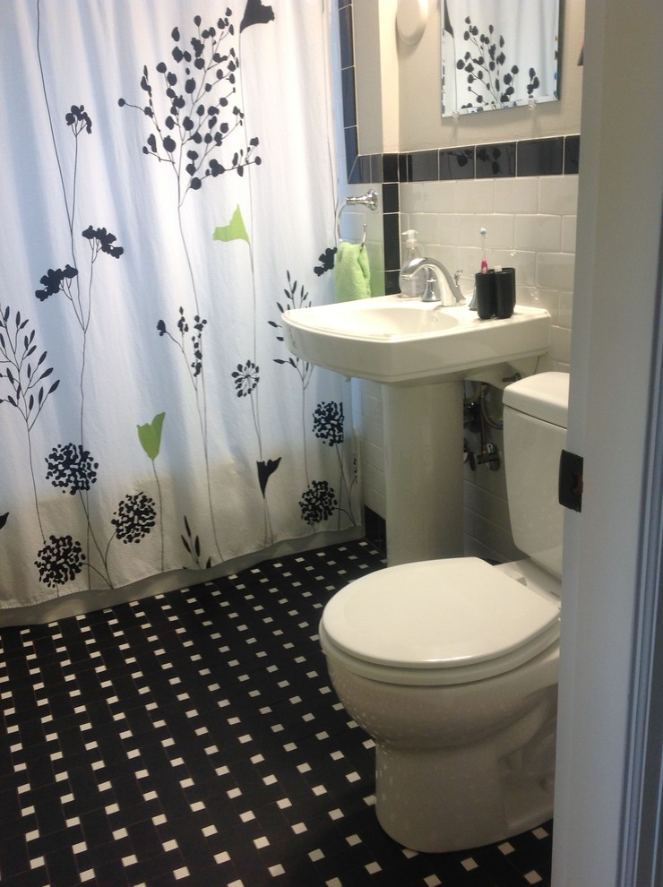 Example of a small kids' black tile and porcelain tile mosaic tile floor alcove bathtub design in Boston with a pedestal sink and a two-piece toilet