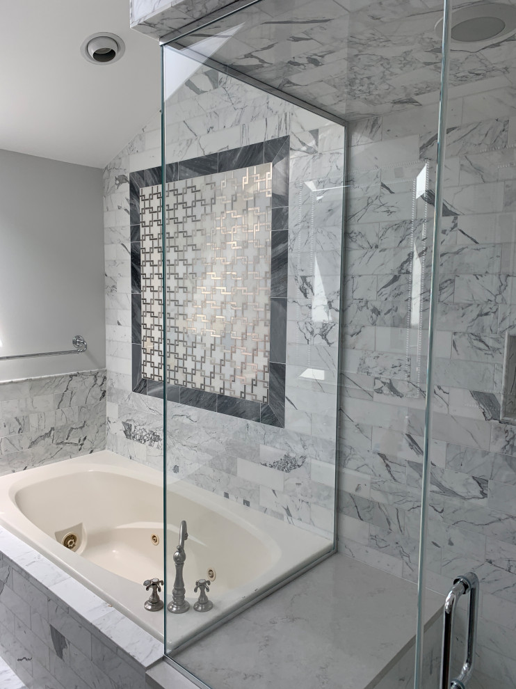 Inspiration for a large classic ensuite bathroom in Chicago with freestanding cabinets, black cabinets, a built-in bath, a corner shower, a bidet, white tiles, marble tiles, grey walls, marble flooring, a submerged sink, engineered stone worktops, grey floors, a hinged door, white worktops, a shower bench, double sinks, a freestanding vanity unit and a vaulted ceiling.