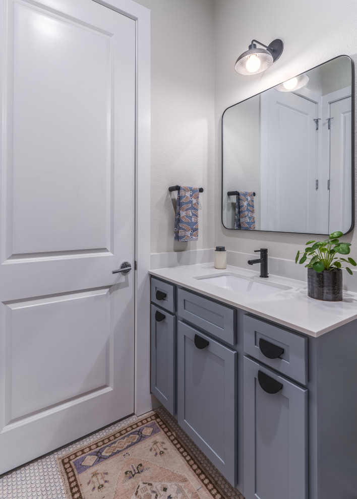 Design ideas for a mid-sized transitional bathroom in Austin with shaker cabinets, purple cabinets, a drop-in tub, a shower/bathtub combo, gray tile, ceramic tile, white walls, ceramic floors, an undermount sink, engineered quartz benchtops, beige floor, a shower curtain, white benchtops, a single vanity and a built-in vanity.