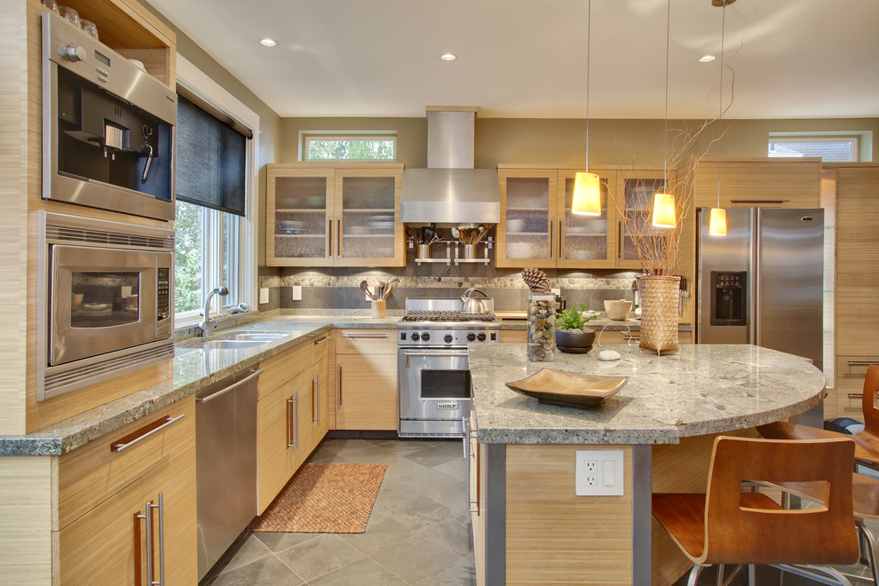 Inspiration for a mid-sized contemporary l-shaped kitchen in Seattle with a double-bowl sink, light wood cabinets, granite benchtops, multi-coloured splashback, stainless steel appliances, ceramic floors, with island and flat-panel cabinets.