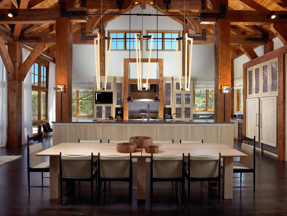 Design ideas for a mid-sized country l-shaped eat-in kitchen in Other with dark hardwood floors, brown floor, an undermount sink, shaker cabinets, light wood cabinets, quartz benchtops, panelled appliances and with island.