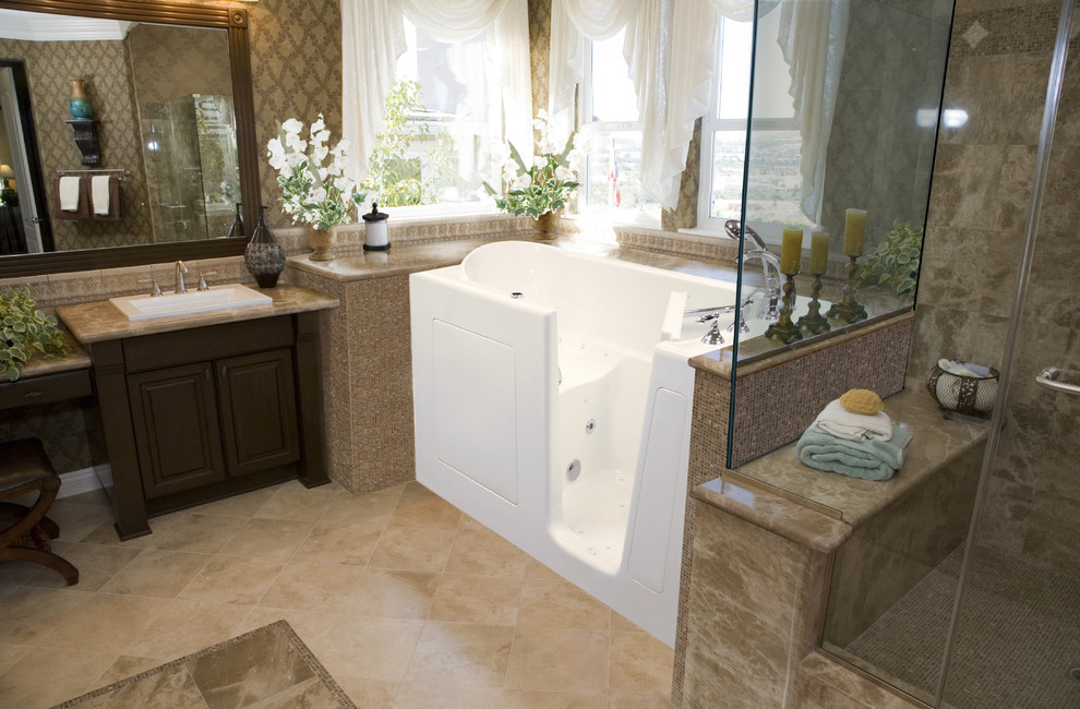 Mid-sized transitional master bathroom in San Diego with an alcove tub, a corner shower, brown walls, ceramic floors, a drop-in sink, raised-panel cabinets, dark wood cabinets, granite benchtops, brown tile, ceramic tile, beige floor and a hinged shower door.