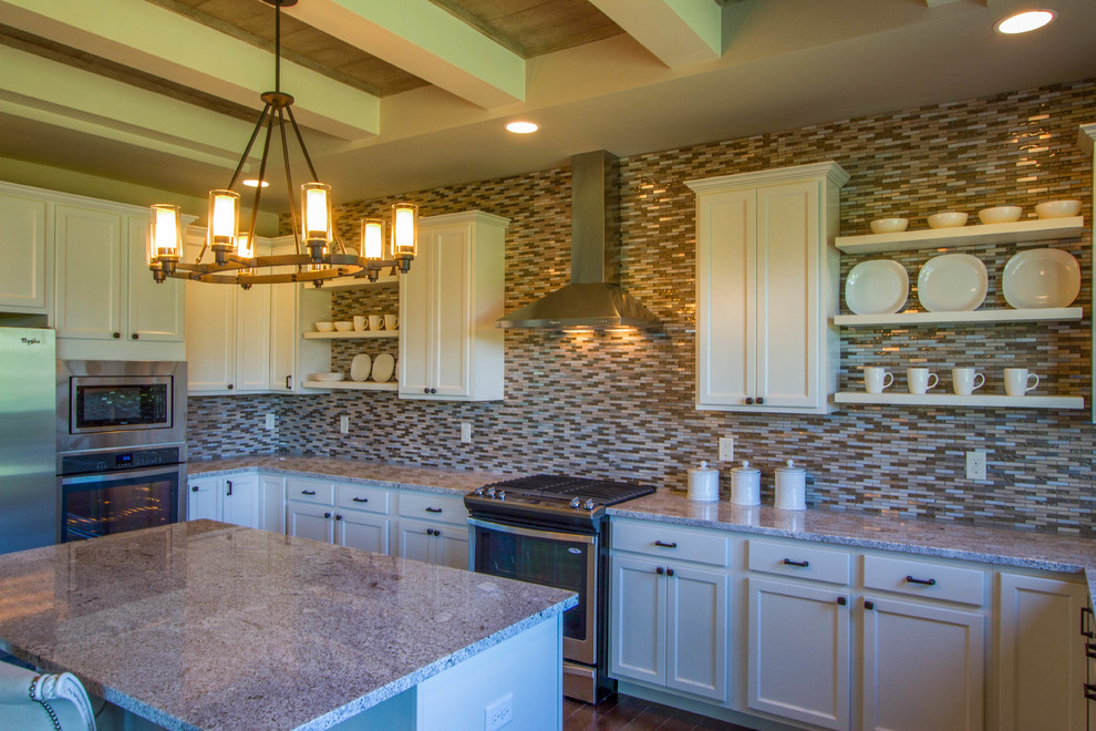 Open concept kitchen - large transitional u-shaped dark wood floor and brown floor open concept kitchen idea in Cincinnati with a double-bowl sink, shaker cabinets, white cabinets, granite countertops, multicolored backsplash, matchstick tile backsplash, stainless steel appliances and an island