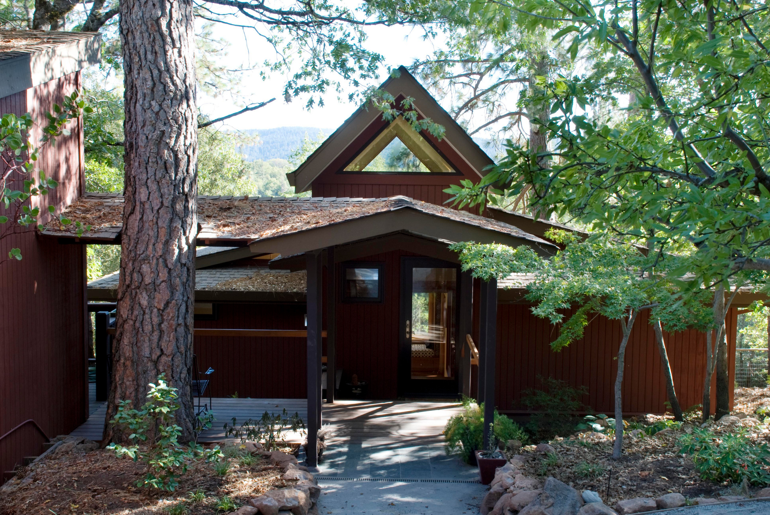 Covered entry with cottage beyond