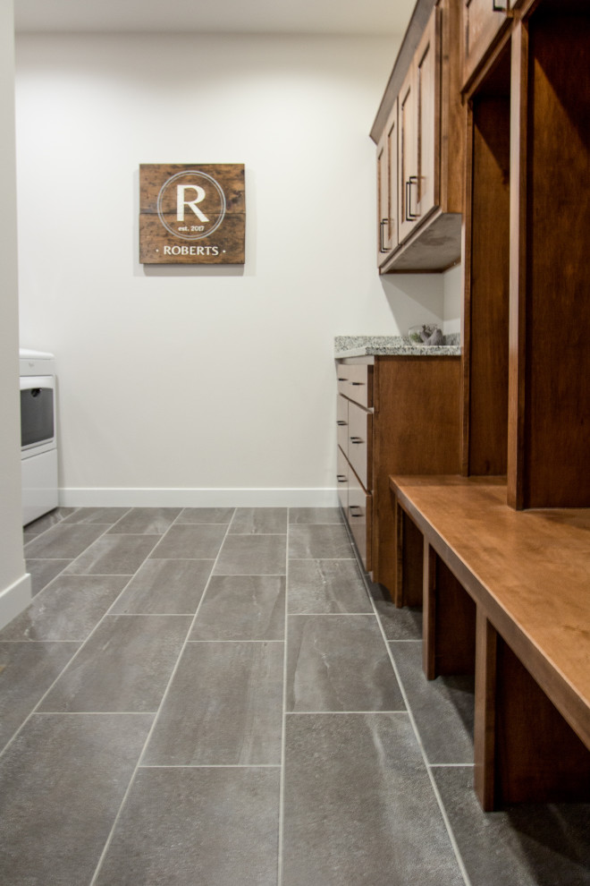 Photo of a classic utility room in Other with ceramic flooring and grey floors.