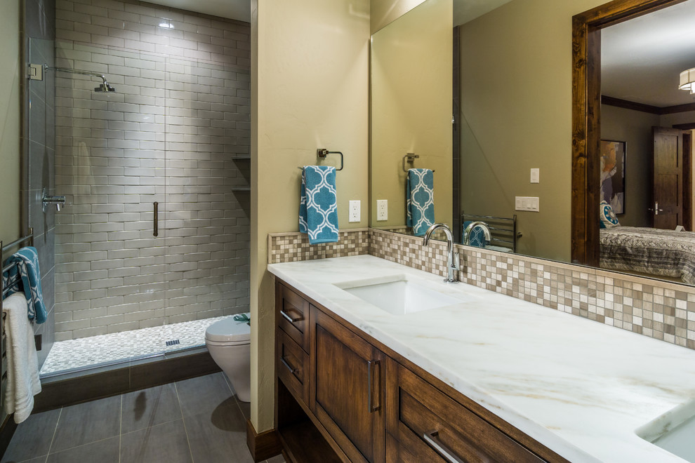 Mid-sized asian master bathroom in Other with beaded inset cabinets, medium wood cabinets, an open shower, a two-piece toilet, ceramic floors, an undermount sink and marble benchtops.