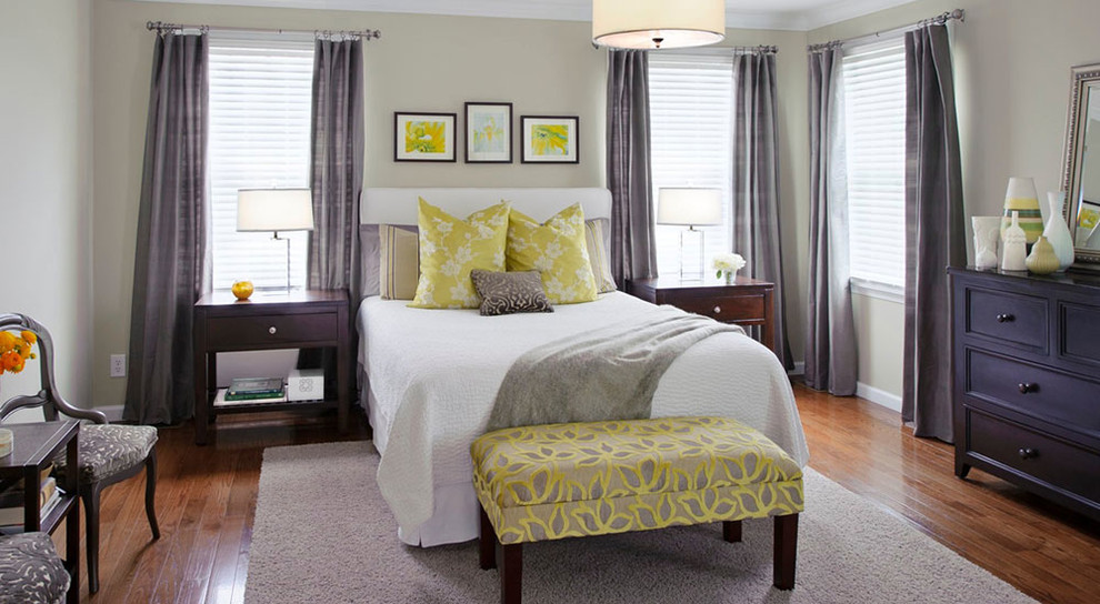Inspiration for a large contemporary master bedroom in St Louis with beige walls, dark hardwood floors and no fireplace.