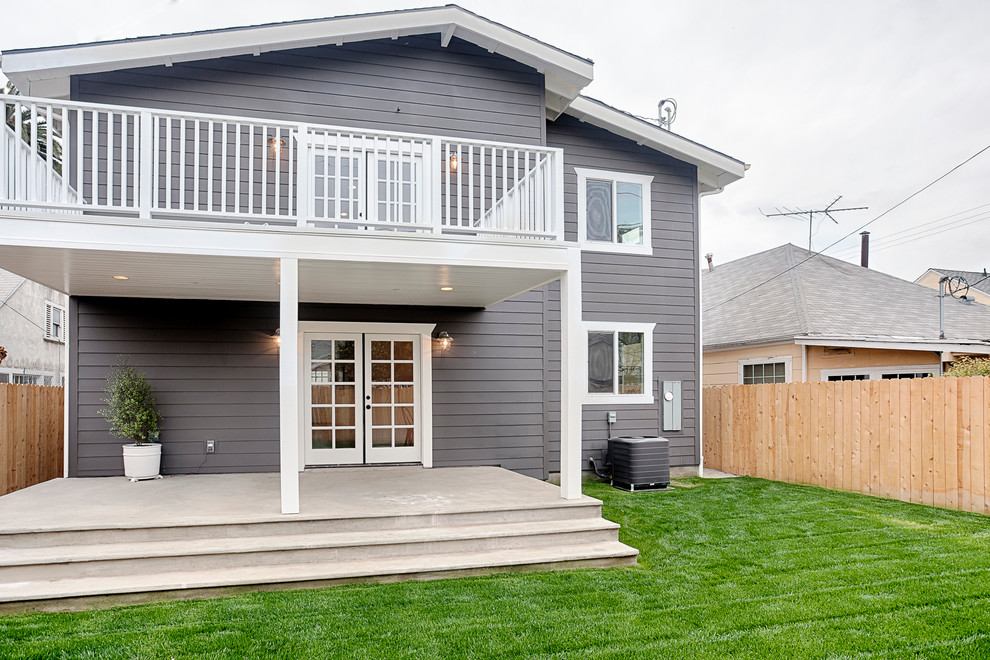 Example of a mid-sized arts and crafts gray two-story concrete fiberboard exterior home design