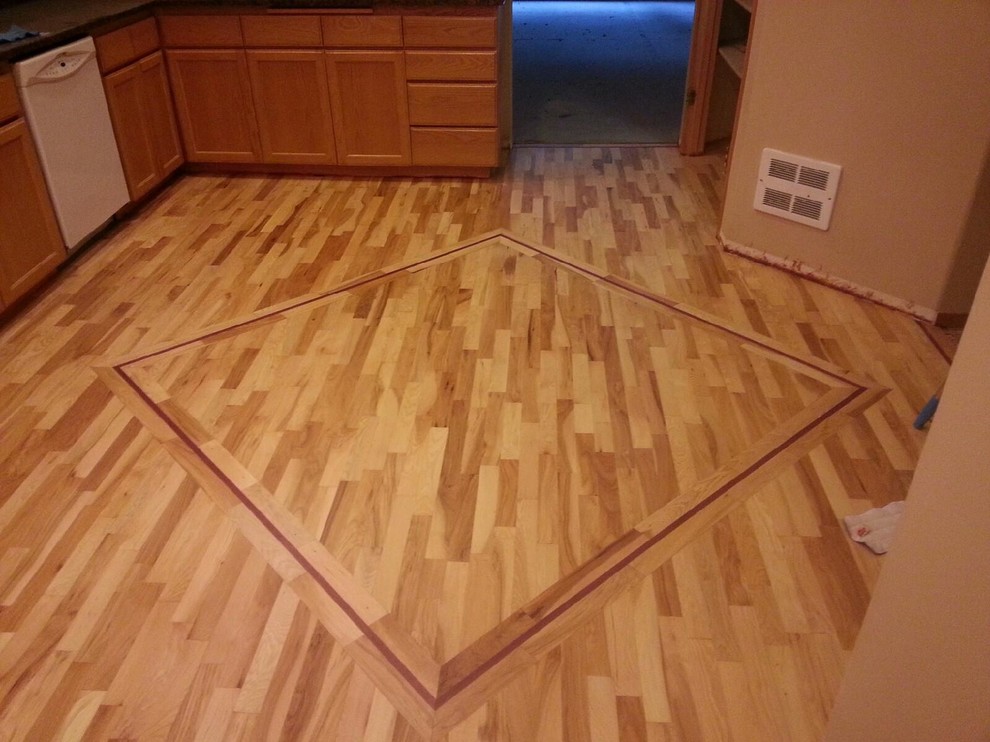 Example of a light wood floor kitchen design in Seattle