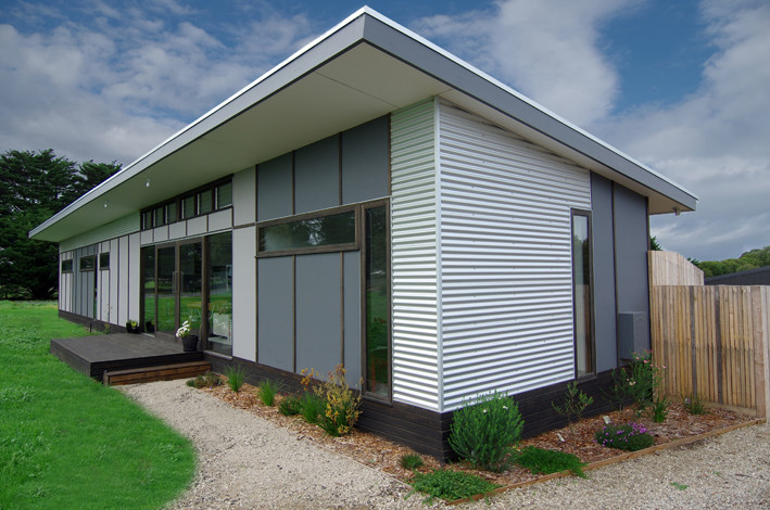Design ideas for a small contemporary one-storey exterior in Melbourne with metal siding.